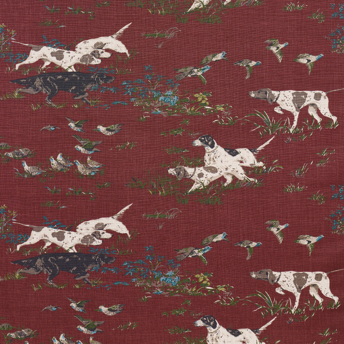 Burgundy fabric featuring white dogs with black patches, blue flowers and greenery in a vintage toile-style print.