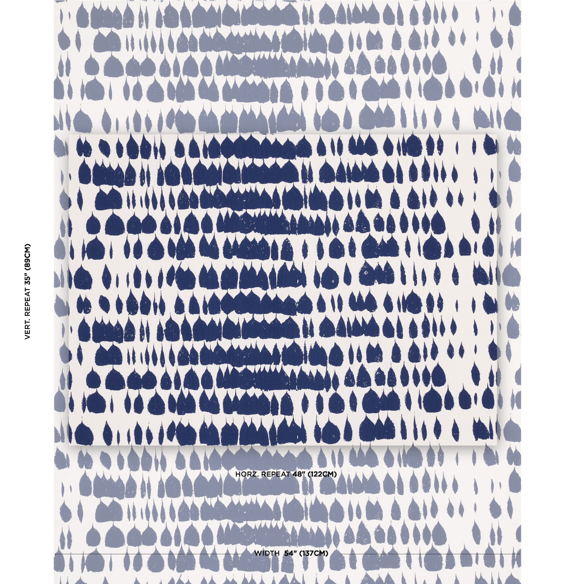Folded white fabric with dense navy teardrop print; modern abstract textile/scarf in blue tones.