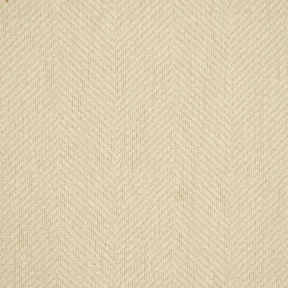 Beige herringbone fabric texture with subtle diagonal weave; soft, neutral appearance.
