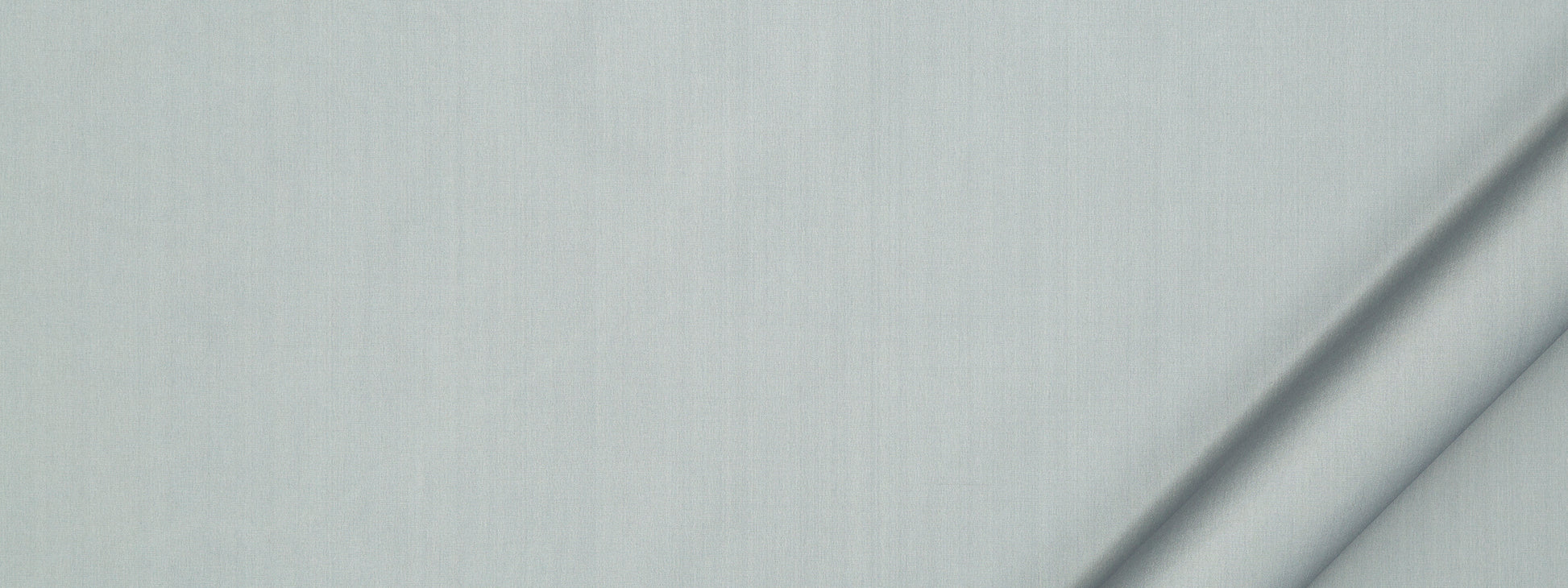 Soft light blue fabric with subtle vertical weave and a diagonal fold along the right edge.