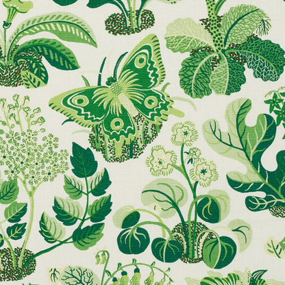Green butterfly among lush botanical leaves on ivory fabric.