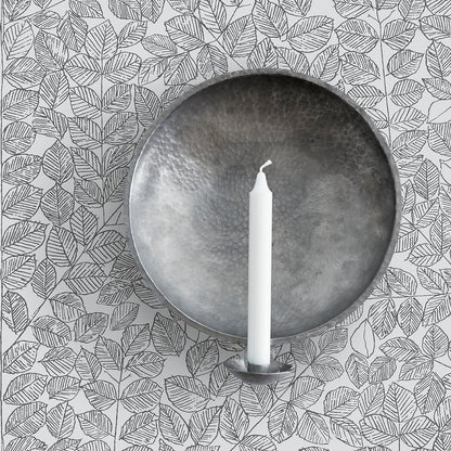 Wallpaper swatch in black featuring a decorative repeating pattern.