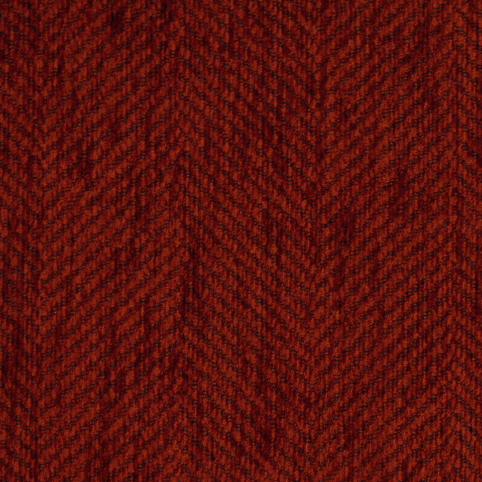 Rust red wool tweed upholstery fabric with a chevron weave; textured fabric suitable for furniture.