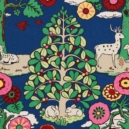 Whimsical woodland fantasy forest print on blue background with green-leaved trees, rabbits, deer and blooming flowers.
