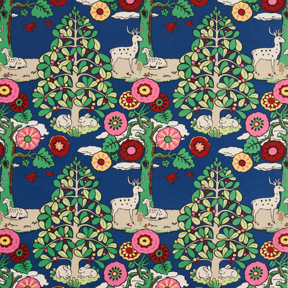 Bright blue fabric with whimsical woodland print: deer, rabbits, stylized trees and vivid pink, red, yellow flowers.