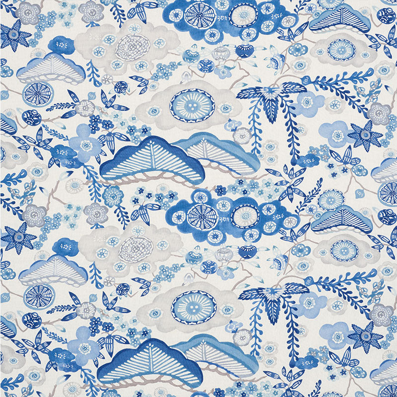 Blue and white floral textile print with fan shapes, circular blossoms, and winding vines.