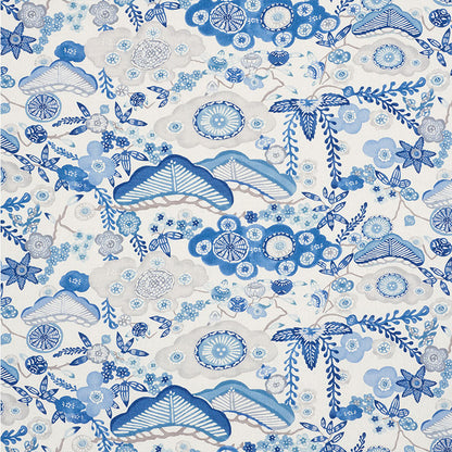 Blue and white floral textile print with fan shapes, circular blossoms, and winding vines.