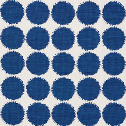Cream woven fabric with a grid of navy blue circles featuring jagged, fringe-like edges.