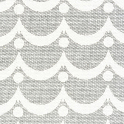 Gray wallpaper with a repeating white scallop wave pattern and circular dots.