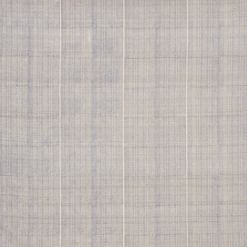 Indigo Mohave print on light blue and beige plaid fabric with a linen-like texture, suitable for drapery or upholstery.