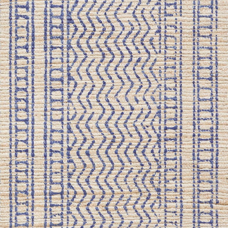 Natural beige flatweave rug with blue zigzag center and geometric border; handwoven boho/traditional decor.