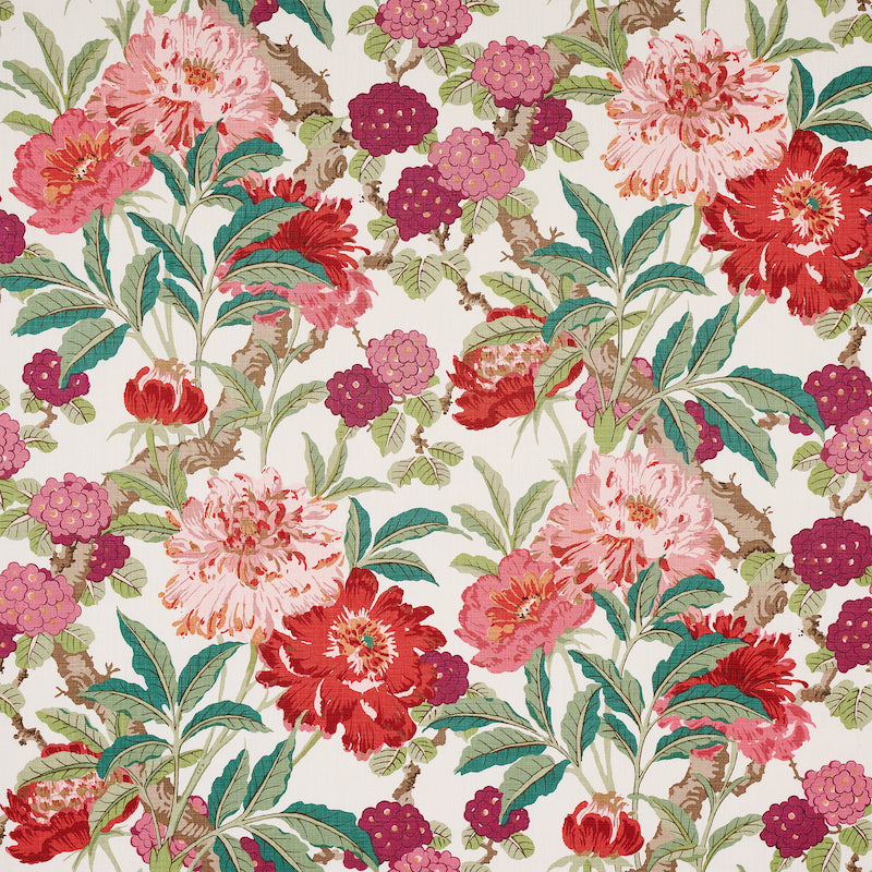 Floral fabric print with pink and red peonies, purple blossoms and green leaves on cream.