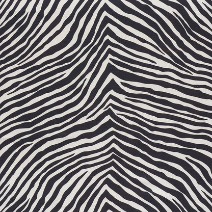 Zebra-print black and white fabric with bold, wavy stripes across the surface