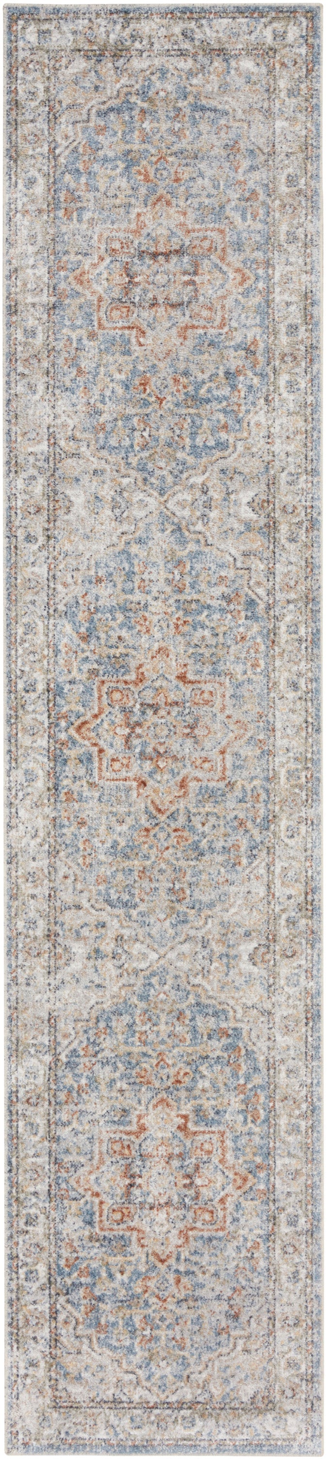 Long beige runner rug with ornate blue and rust medallion motifs and distressed detailing.