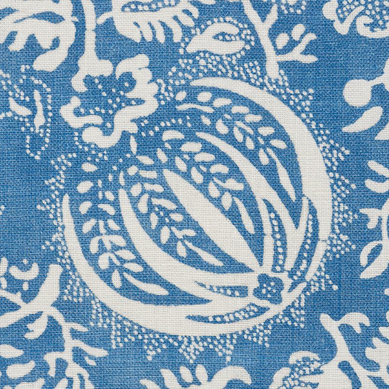 Indigo chambray fabric with white pomegranate print; linen/cotton textile for throw or curtain.