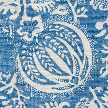 Indigo chambray fabric with white pomegranate print; linen/cotton textile for throw or curtain.