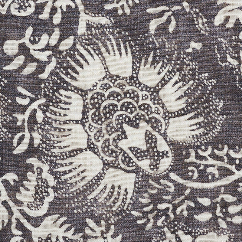Charcoal chambray fabric with a pomegranate print in cream.