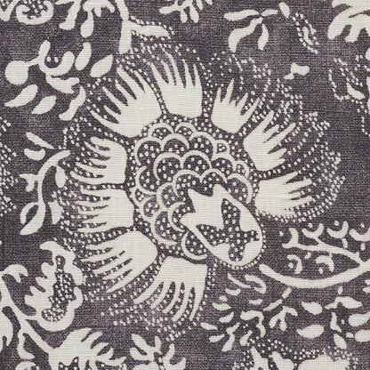 Charcoal chambray fabric with a pomegranate print in cream.