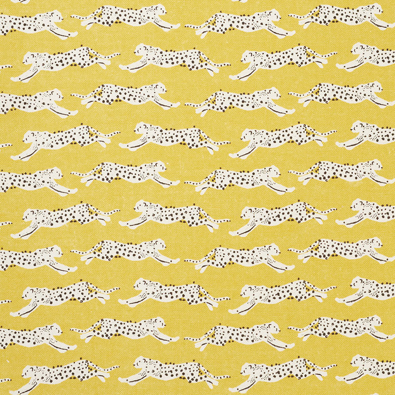 Yellow seamless print with white leopards and black spots in a running pose.