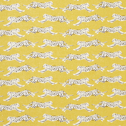 Yellow seamless print with white leopards and black spots in a running pose.