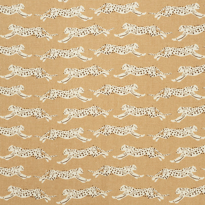 Beige fabric with a repeating pattern of white leopards and black spots in a safari-style print.