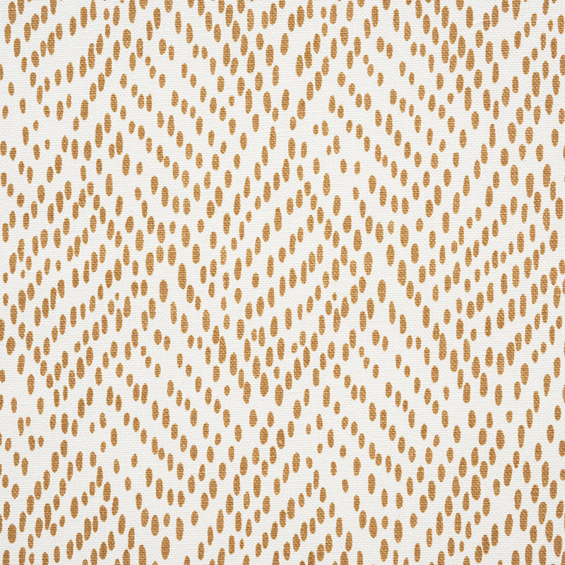 Golden-brown dotted geometric textile pattern forming diamond motifs on cream background.