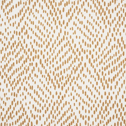Golden-brown dotted geometric textile pattern forming diamond motifs on cream background.