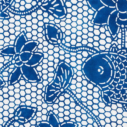 Blue floral lace pattern on white fabric with hexagonal mesh background, decorative textile for clothing or decor