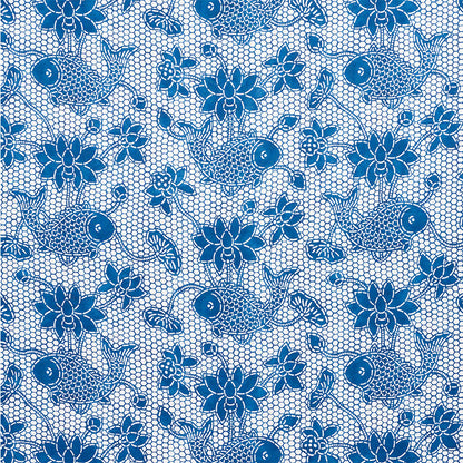 Blue koi fish and floral lace pattern on white mesh fabric; decorative textile for dresses or accessories.