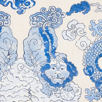 Blue and light-blue dragon and cloud motif on porcelain surface; decorative dragon print.