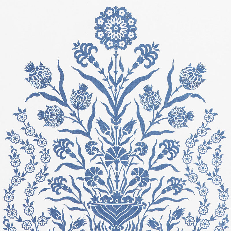 Blue floral damask pattern with a central vase and symmetrical blossoms and leaves on white.