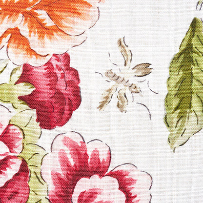 Floral fabric print with vivid orange, pink and red blooms and green leaves on white linen-like background.