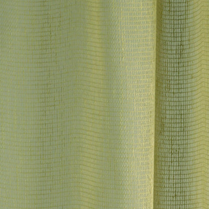 Close-up of lime-yellow woven fabric with grid texture and vertical folds; two-tone light to dark yellow-green.