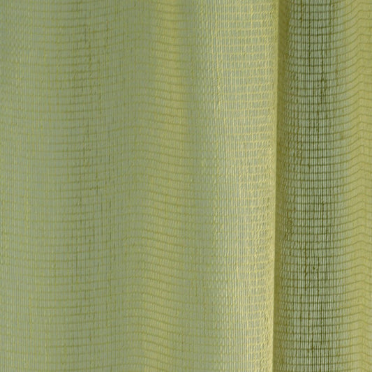 Close-up of lime-yellow woven fabric with grid texture and vertical folds; two-tone light to dark yellow-green.
