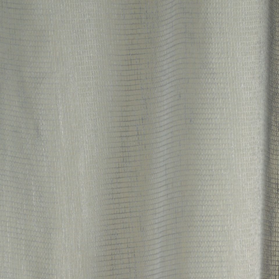 Beige linen-like fabric close-up with fine woven stripes; soft, lightweight material for curtains or upholstery.