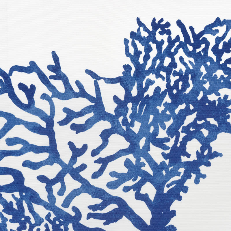 Bold blue coral pattern with abstract branches on a white backdrop; decorative textile or wallpaper design.