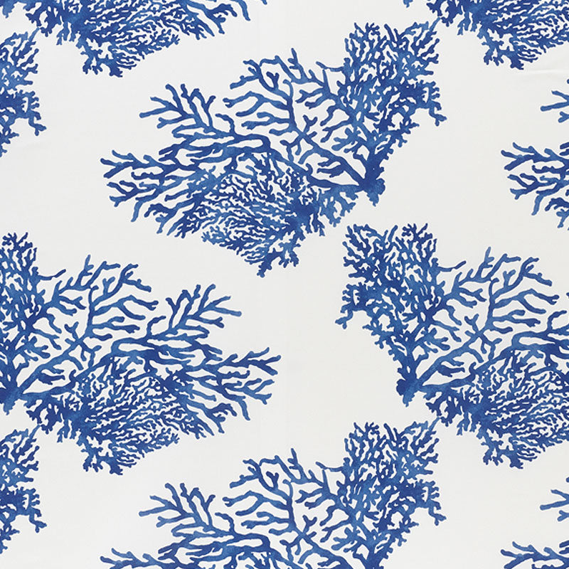 Navy blue coral pattern on white fabric; coastal textile with branching reef silhouettes.