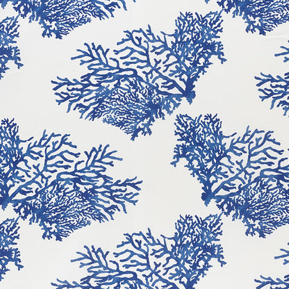 Navy blue coral pattern on white fabric; coastal textile with branching reef silhouettes.