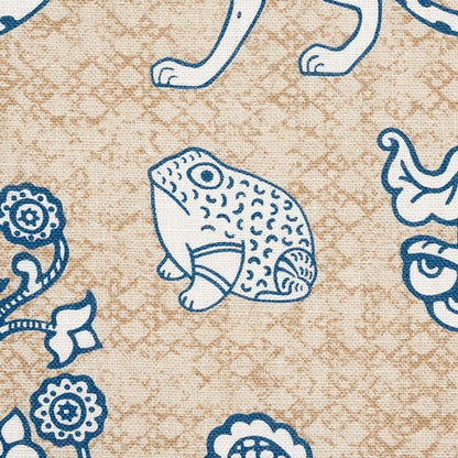 Beige fabric with blue outlined frog and floral doodles in a vintage-style pattern.
