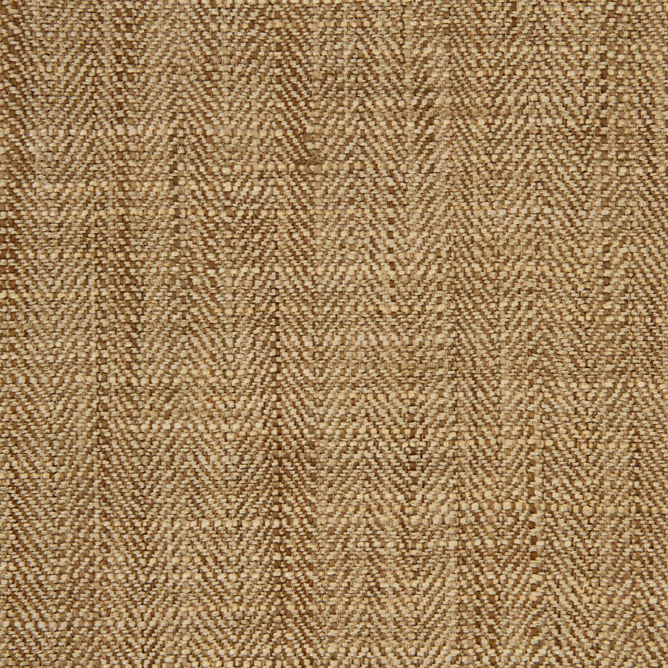 Brown and tan woven tweed fabric with a herringbone pattern, textured natural fibers.