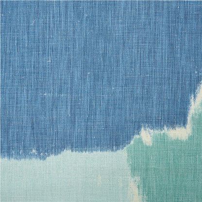 Blue denim-style fabric swatch with a pale mint green bottom edge; abstract woven texture