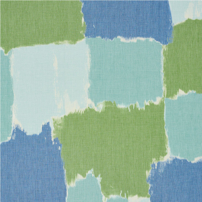 Abstract patchwork of blue, aqua and green squares with rough edges on textured fabric.