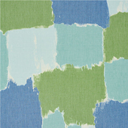 Abstract patchwork of blue, aqua and green squares with rough edges on textured fabric.