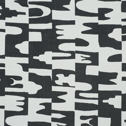 Black and white abstract camo-like textile pattern with irregular, blocky shapes.