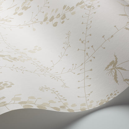 Cream wallpaper with delicate beige botanical vines and small leaves; curved roll edge visible.