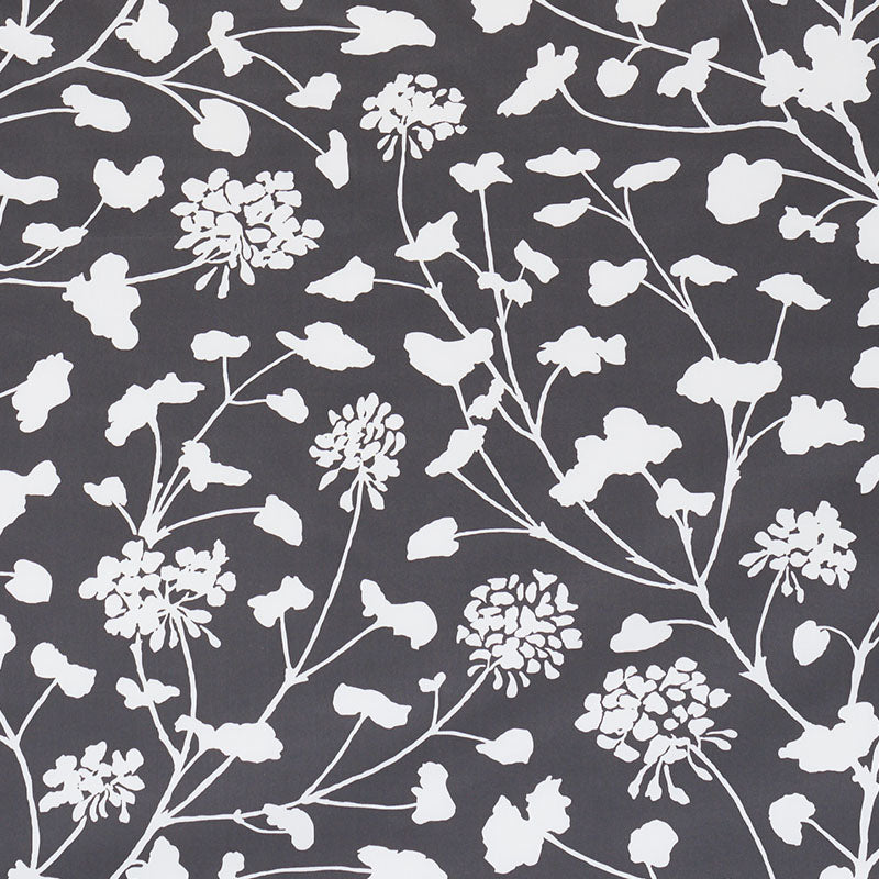 Dark gray fabric with white botanical floral pattern of branching stems and clustered blooms.