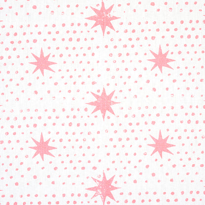 White fabric with pink eight-point starburst motifs and small dot accents; playful geometric print for textiles.