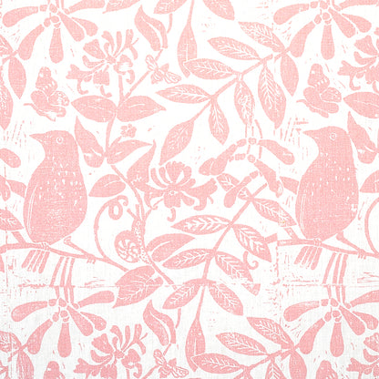 Soft pink botanical pattern with birds on branches and leaves, a repeating floral design for wallpaper or fabric.