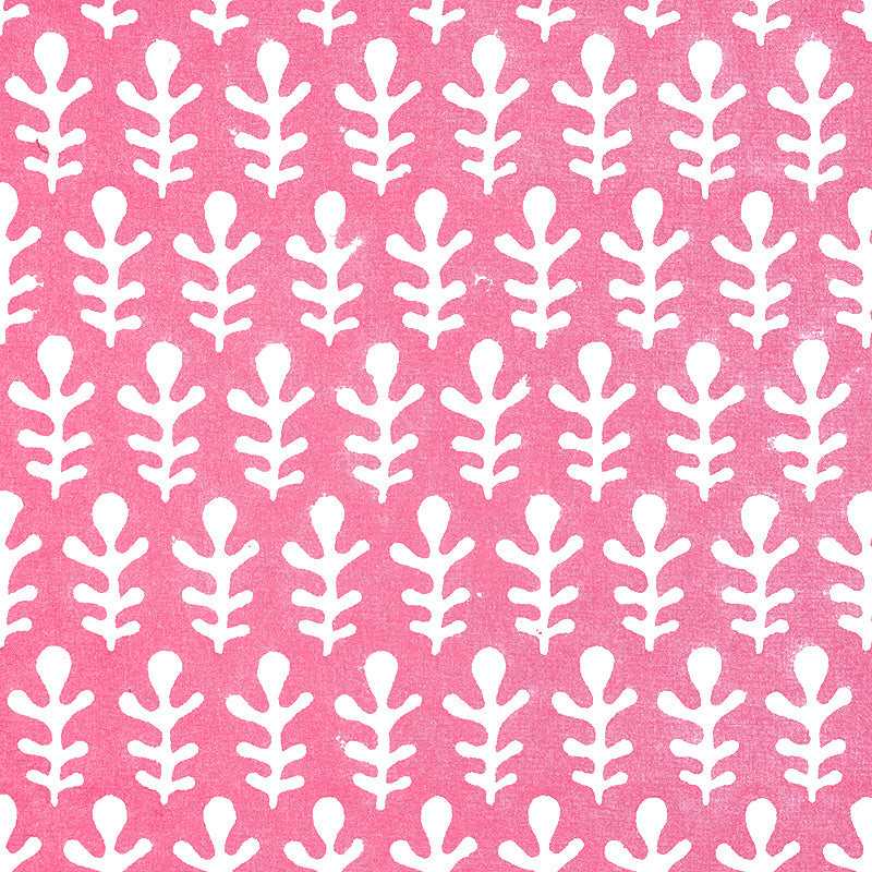 Pink fabric with a repeating white fern-like leaf pattern; bold botanical print for upholstery or curtains.