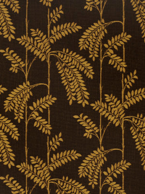 Dark brown fabric with gold fern leaf motif; botanical print textile for upholstery.